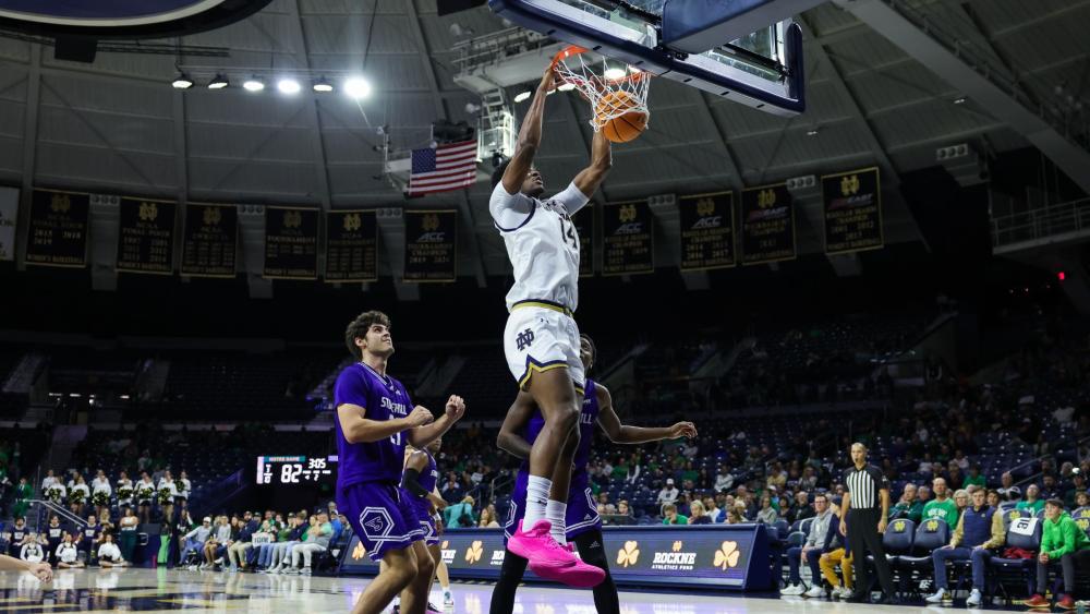 Kebba Njie slams it home in the season opener against Stonehill. (Photo courtesy of Notre Dame Athletics)